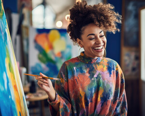 Passionate African American Artist in Vibrant Blue Smock: Immersed in Canvas Creation with Curly Bun Elegance
