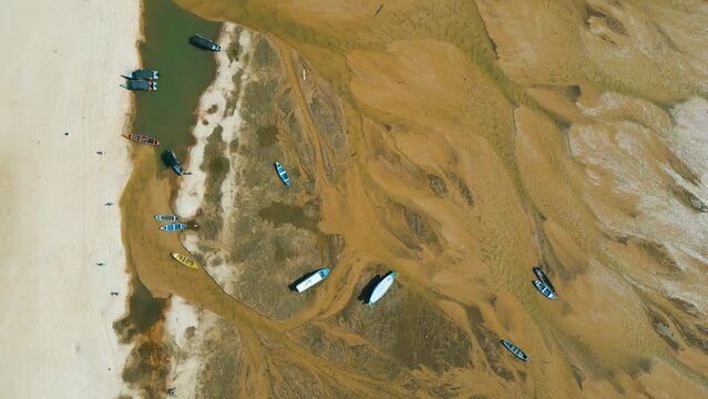 Aerial view of small boats stranded in the nearly dry bed of the Tapajos river in Alter do Chao, Santarem, Brazil, during the amazonian drought in the second half of 2023