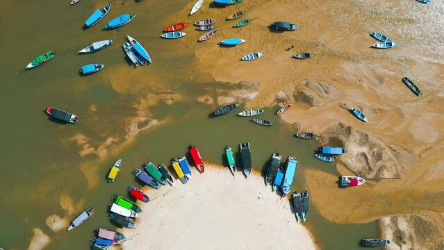 Aerial view of small boats stranded in the nearly dry bed of the Tapajos river in Alter do Chao, Santarem, Brazil, during the amazonian drought in the second half of 2023