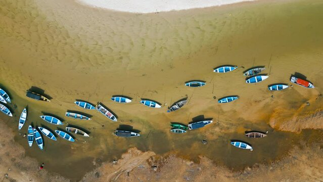 Aerial view of small boats stranded in the nearly dry bed of the Tapajos river in Alter do Chao, Santarem, Brazil, during the amazonian drought in the second half of 2023