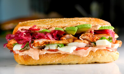 Roasted chicken sandwich with spicy aoli and pickles onions