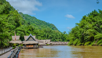 Fototapeta premium Tropical beach houses on the River Kwai in Thailand.Wooden floating raft house in river Kwai Kanchanaburi, Thailand