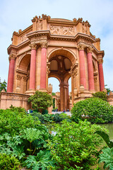 Open rotunda across green lagoon like a decaying ruin of ancient Rome at Palace of Fine Arts