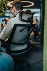 Focused entrepreneur conducts online market research to target audience, ensuring profit growth....