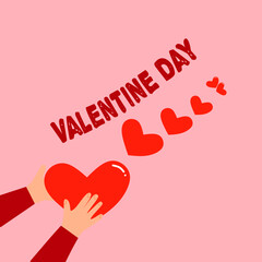 hand holding heart with valentine word