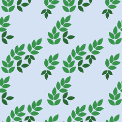 Ornament of green leaves on a light blue background. Diagonal arrangement. Seamless pattern. Background for paper, cover, fabric, interior decor.