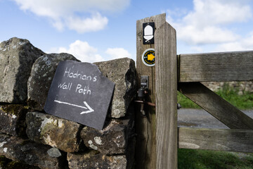a sign directing walkers to Hadrian Wall Path, near Gilsland, Northumberland, UK