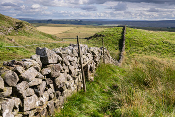 view of Northumberland countryside on Hadrian's Wall Path near Once Brewed, Northumberland, UK