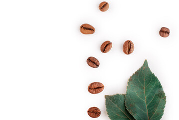 coffee beans and leaves on a white background.