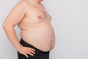 Close-up of a fat man's belly, isolated on a white background.