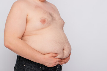 Close-up of a fat man's belly, isolated on a white background.