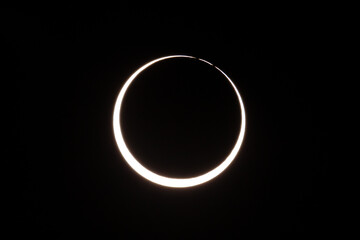 Photograph of an annular solar eclipse that occurred on October 14, 2023.   An annular solar eclipse occurs when the Moon's diameter is smaller than the Sun's, blocking most of the Sun's light. 