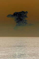 dense black cloud after the explosion and the sky dyed red and under the sea