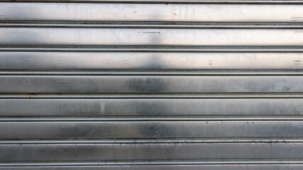Background grey steel store line metal facade curtain shuttle rolling shutter metal gate gray backdrop