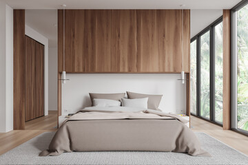 Wooden hotel bedroom interior with bed, decoration and panoramic window