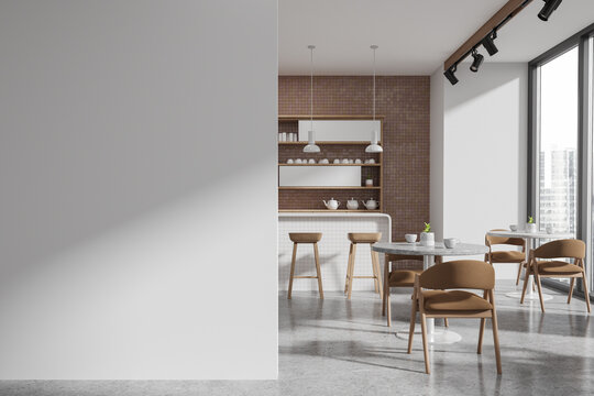 White and beige cafe interior with bar and blank wall