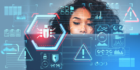 African woman with laptop and cybersecurity bug interface