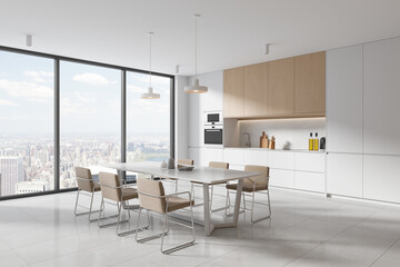 White and wooden kitchen corner with dining table