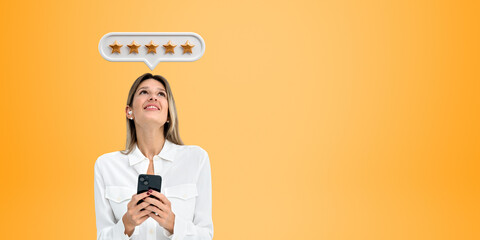 Smiling business woman with smartphone giving five stars feedback, copy space