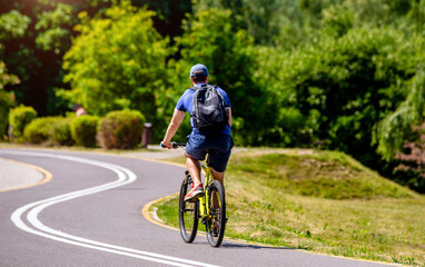 Cyclist ride on the bike path in the city Park
