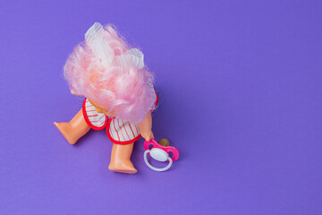 A child's toy. A doll on a colored background. Toy store concept