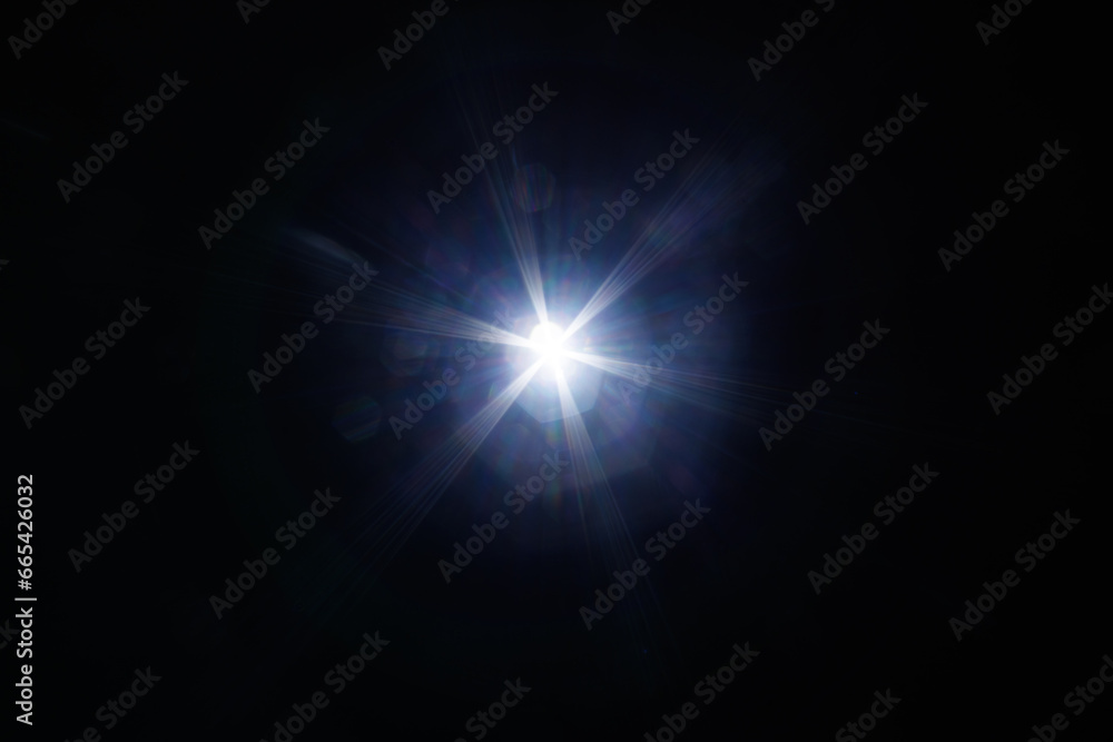 Poster Easy to add lens flare effects for overlay designs or screen blending mode to make high-quality images. Abstract sun burst, digital flare, iridescent glare over black background.