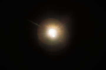 Easy to add lens flare effects for overlay designs or screen blending mode to make high-quality images. Abstract sun burst, digital flare, iridescent glare over black background.