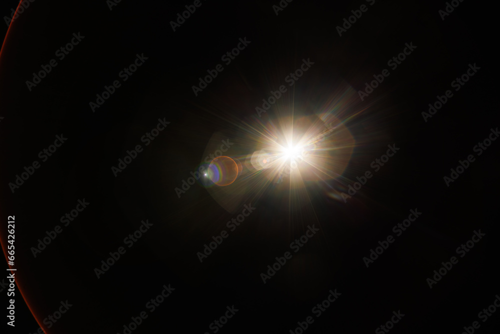 Poster Easy to add lens flare effects for overlay designs or screen blending mode to make high-quality images. Abstract sun burst, digital flare, iridescent glare over black background.