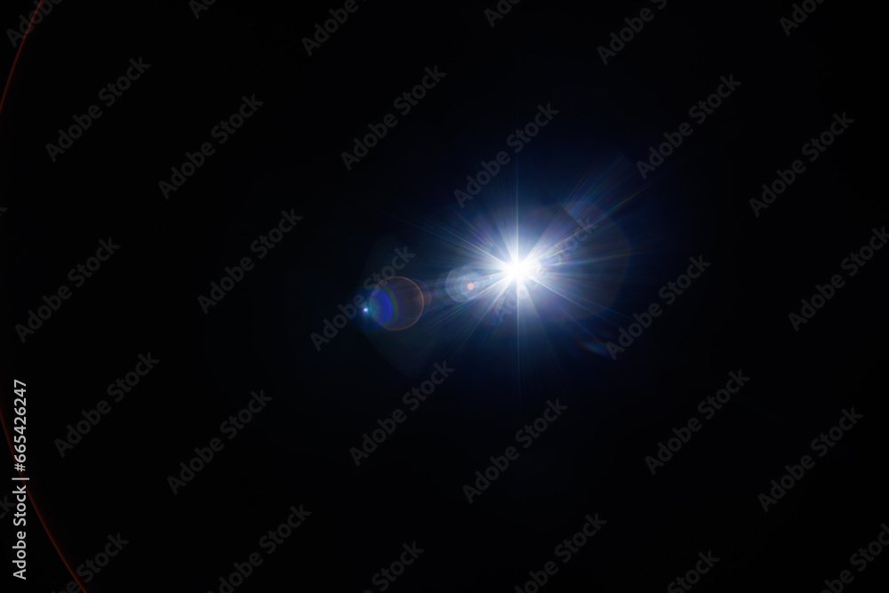 Aufkleber Easy to add lens flare effects for overlay designs or screen blending mode to make high-quality images. Abstract sun burst, digital flare, iridescent glare over black background.