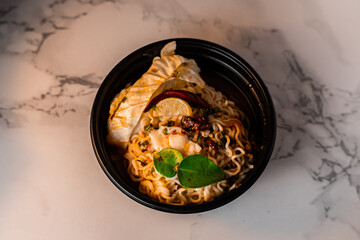 Thai style noodles, top angle view, with lighting and shadows added to add dimension and elegance that hides the boldness. If you add fonts, it will make your work look even better.