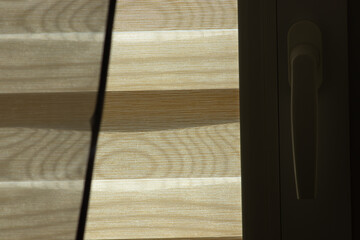  Unique closeup of blinds, transitioning from day to night.