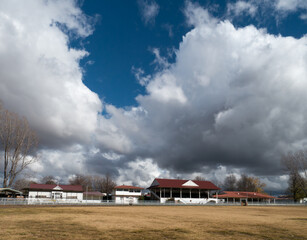 Large billowing clouds over the Glen Innes showground pavilion