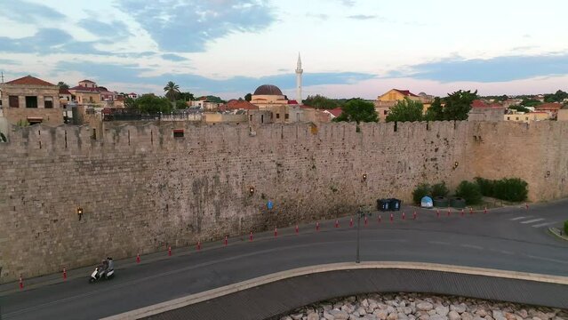 Rhodes old town houses, Mosque of Suleiman and surrounding fortifications at sunrise, Greece,  Aerial view 
