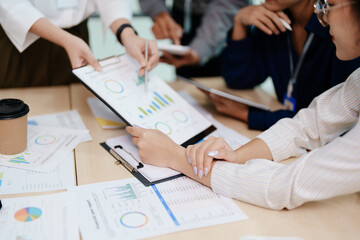 Asian business advisor meeting to analyze and discuss the situation on the financial report in the meeting room.Investment Consultant, Financial , teamwork ,brainstorming ,startup and accounting