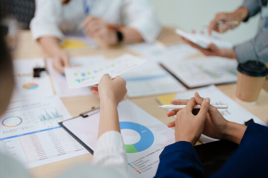 startup business, business advisor strategy for planning finance investment teamwork paperwork audit and discussing marketing, profit, budget of company in meeting room, stock market chart concepts.