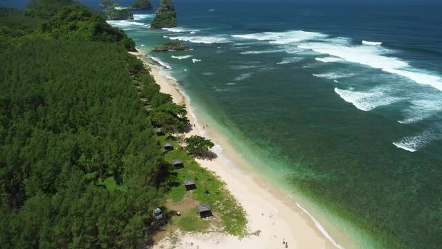 Point of View from the beach, tropical forests and ocean at Tanjung Penyu Mas Beach