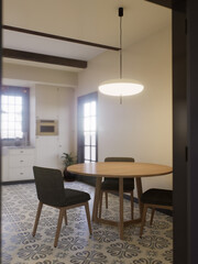 White kitchen with dark red brick, wood, large window and kitchen utensils. 