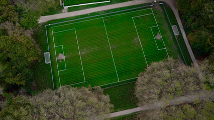 Football field. Training center in forest - 665455279