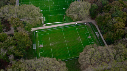 Football field. Training center in forest