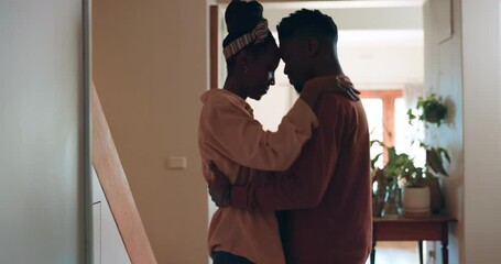 Happy, love and black couple hug in home for bonding, healthy relationship and relax together in living room. Dating, intimate and man and woman embrace for commitment, trust and romance in apartment