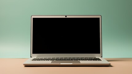 a laptop computer on a green background