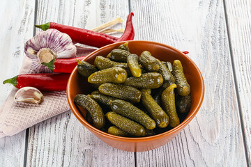 Marinated small cucumbers in the bowl