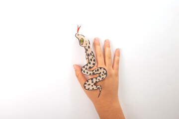 a snake or dragon made out of recycled paper, DIY, tutorial, educational art and craft for kids,