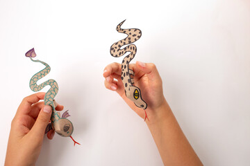 a snake or dragon made out of recycled paper, DIY, tutorial, educational art and craft for kids,