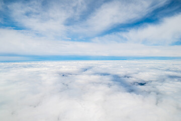 Aerial view White clouds in blue sky. Top view. View from drone. Aerial bird's eye view. Aerial top view cloudscape. Texture of clouds. flight over the clouds background. 