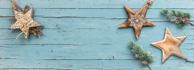 Wooden stars on a rustic blue wooden background