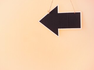 Left arrow hanging chalkboard and copy space 
