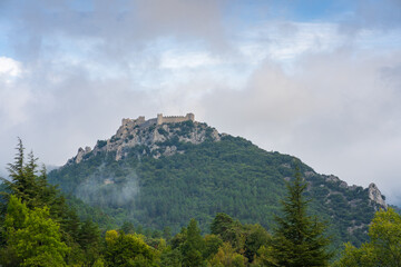 Landscape view of ancient medieval Puilaurens cathar castle ruin on hill, Lapradelle-Puilaurens,...