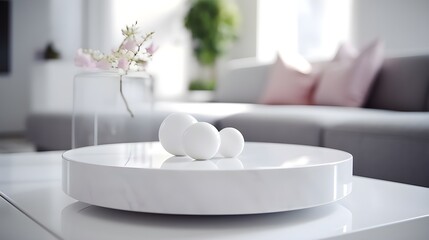Close-up of a white marble coffee table with spherical objects, soft-focus living room