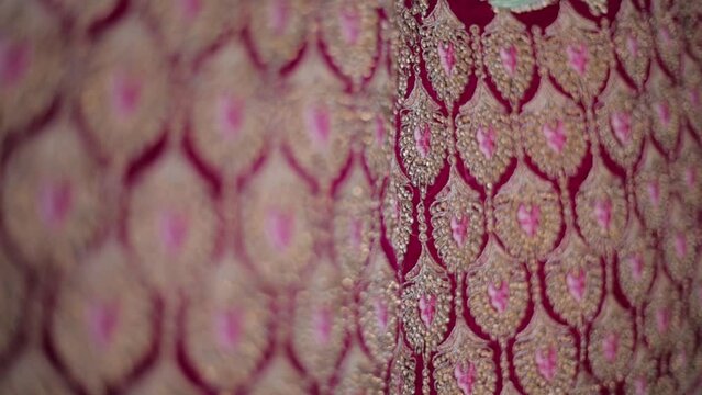 This captivating video showcases the intricate details and exquisite embroidery of a wedding bride's choli design, adding grace and charm to her bridal attire